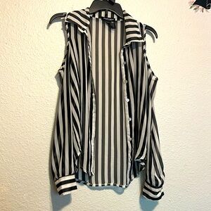 Gorgeous black and white blouse with shoulder cut-outs.  Sheer & button down.